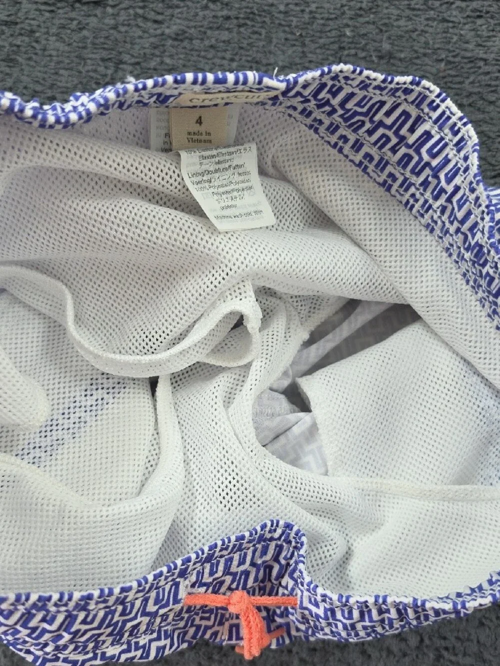 Crewcuts Navy & White Geometric Swim Trunks with Coral Drawstring